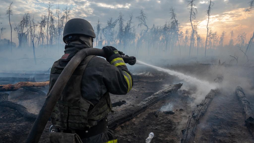 Ukrainian rescuers of the State Emergency Service and firefighters continue to extinguish the forest fire after a Russian bomb explosion in Kharkiv Oblast, Ukraine on September 17, 2024.