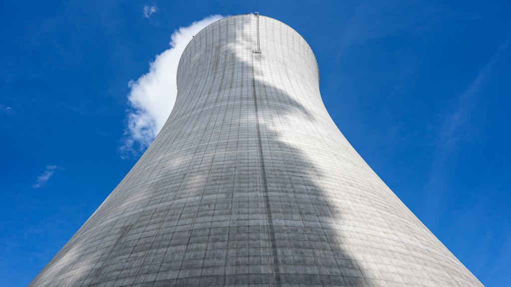 The cone-shaped structure of a cooling tower at a nuclear reactor facility.
