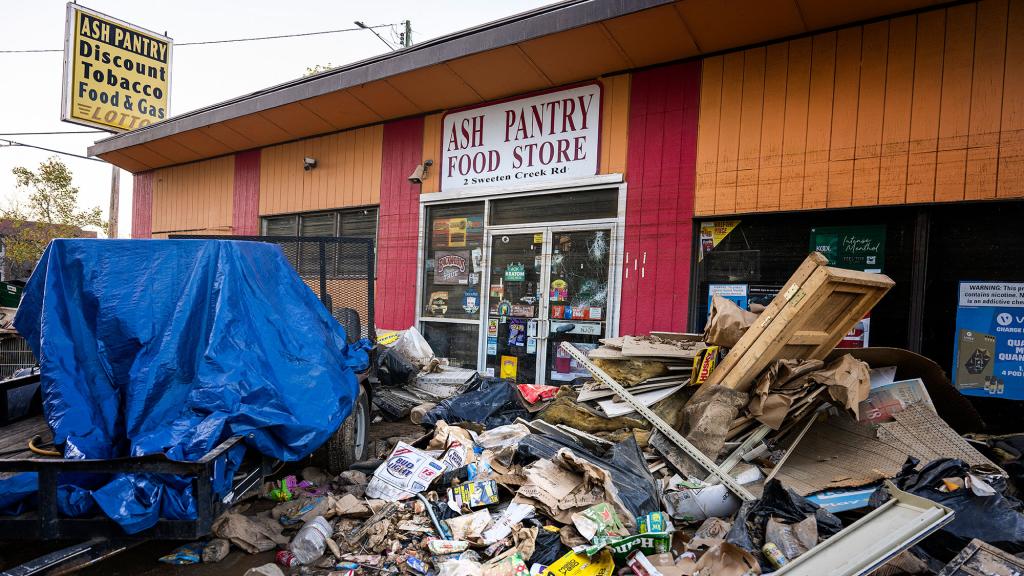 Debris in front of a hurricane-damaged store in Asheville, North Carolina