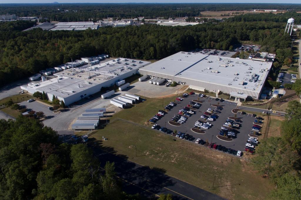 Aerial view of a sterilization facility, surrounded by trees