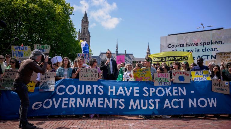 Ralph Regenvanu, the climate minister of the South Pacific nation of Vanuatu, delivers a speech as he attends a demonstration ahead of the International Court of Justice in The Hague.