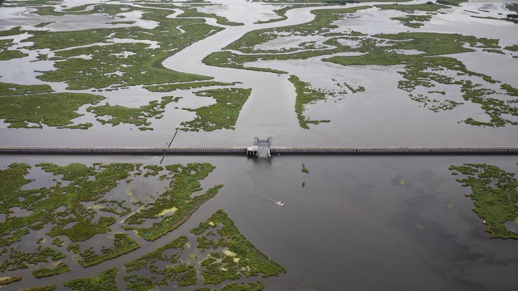 The Lake Borgne Surge Barrier straddles wetlands near New Orleans, Louisiana. The U.S. Army Corps of Engineers built the barrier after Hurricane Katrina to protect the city from storm surge.