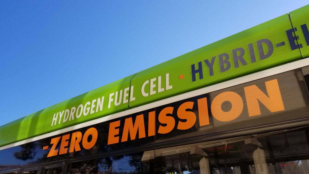 Close-up of text reading Hydrogen Fuel Cell Zero Emission on the side of a city bus in Albany, California, indicating that the bus is powered by a hydrogen fuel cell technology, December 13, 2018.