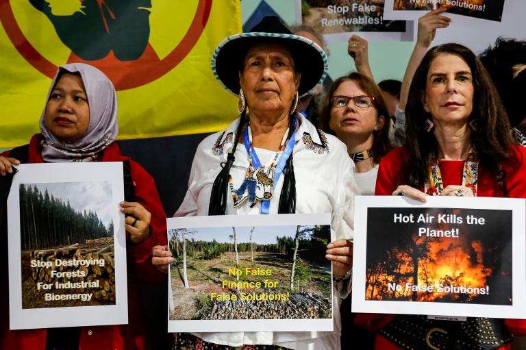 Activists are holding up signs