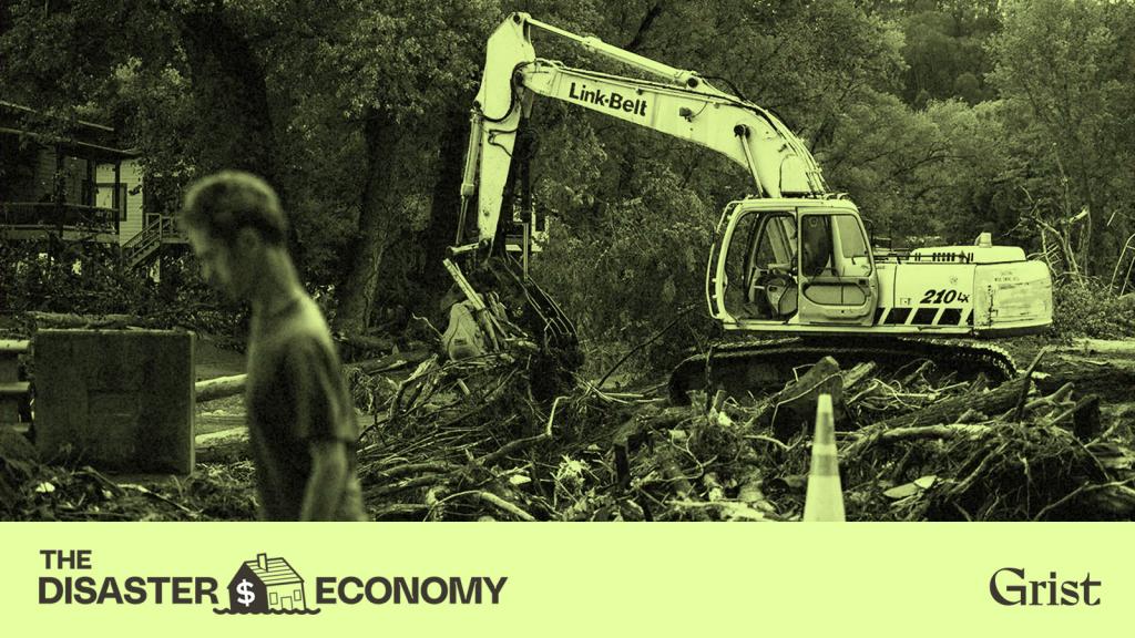 Photo of a man walking past an excavator cleaning up debris