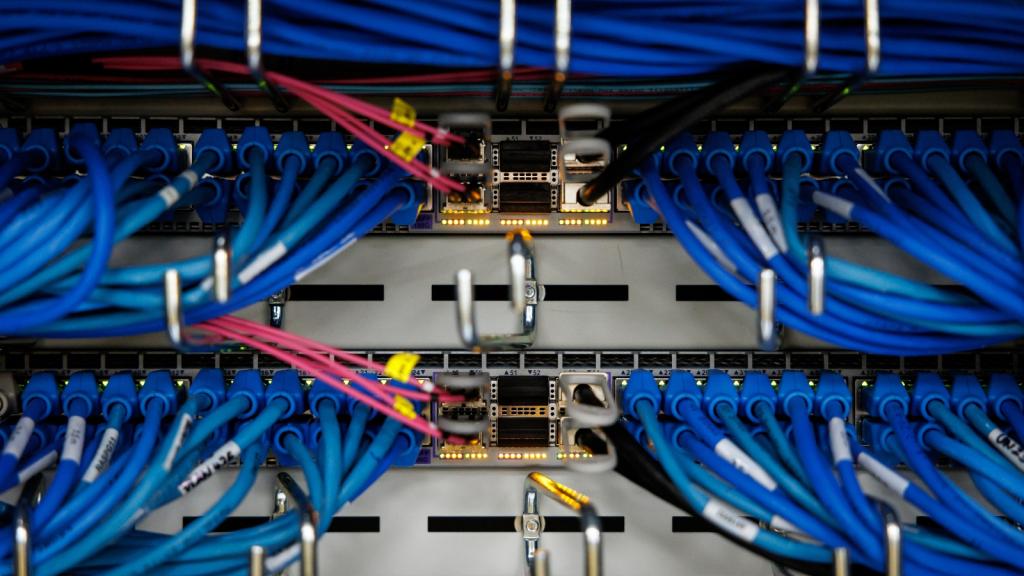 A series of blue and red cables are attached to a machine