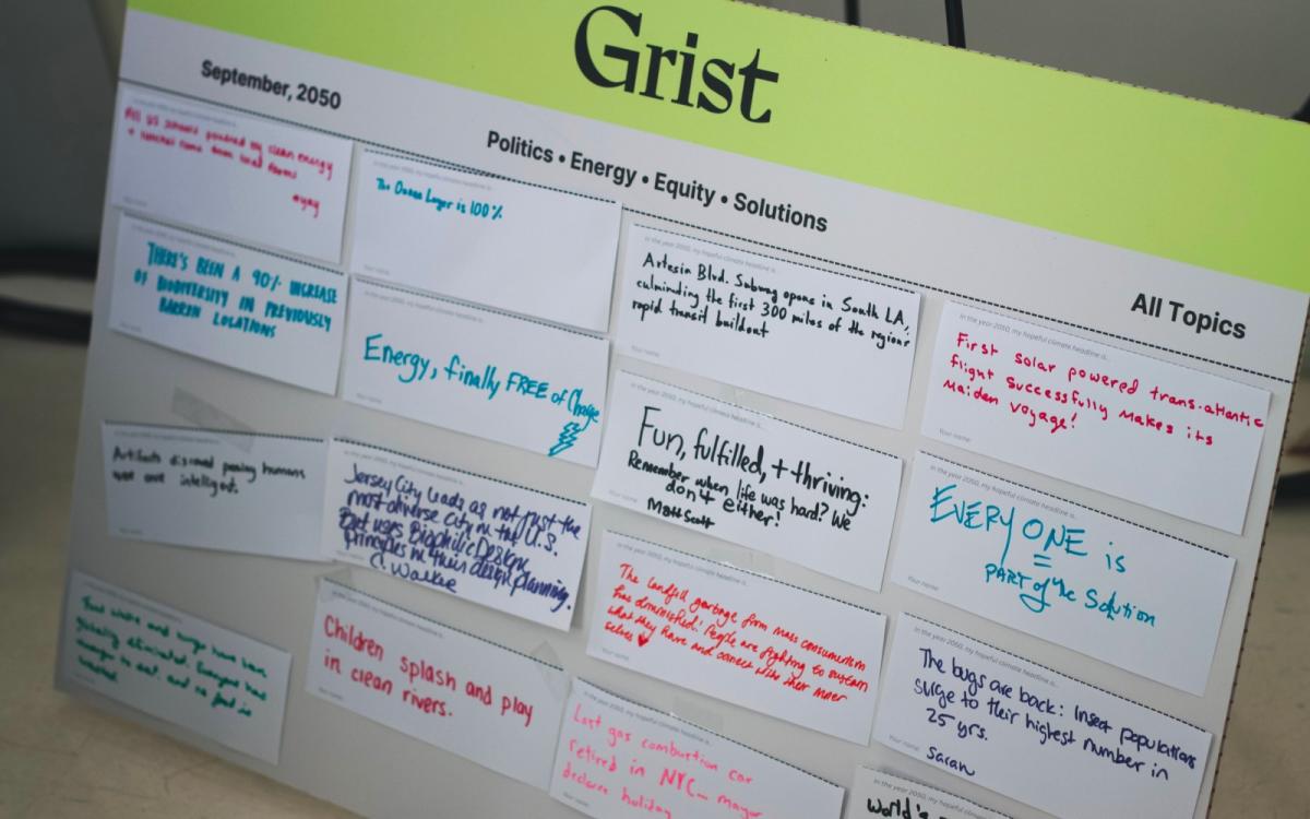 A Grist-branded poster board filled with note cards displaying people's imagined headlines
