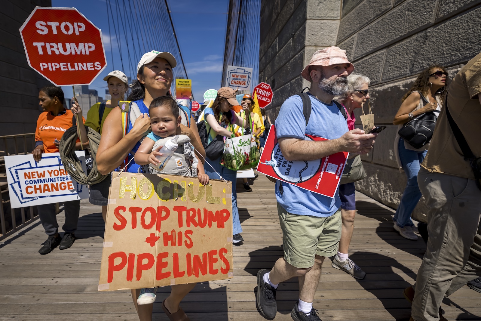 Protestors march across the Brooklyn Bridge