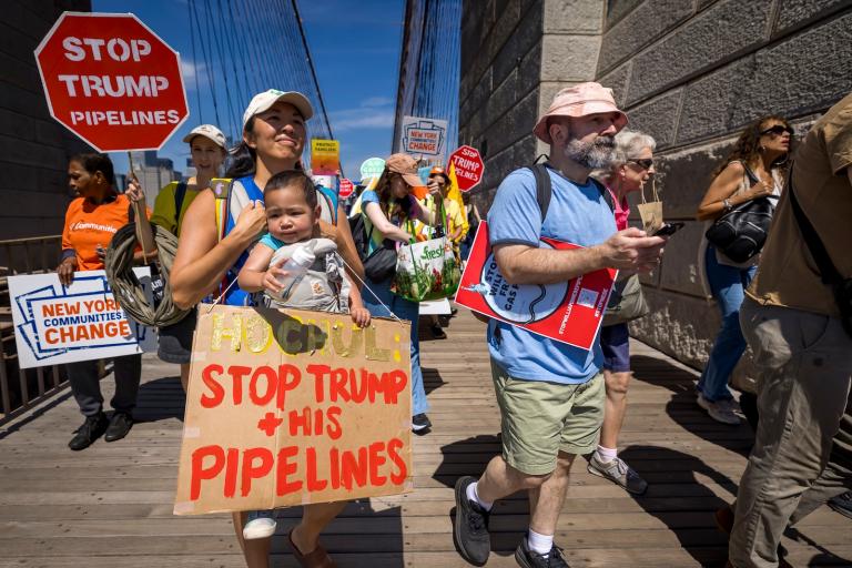 Protestors march across the Brooklyn Bridge