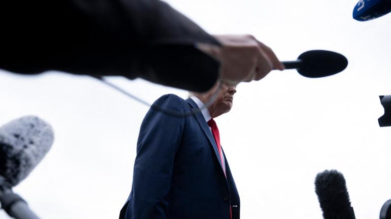 Photo of microphones pointed at Trump
