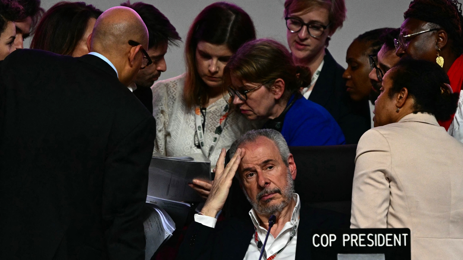 COP30 President Andre Correa do Lago gestures next to his advisers after the plenary session was interrupted following Colombia's intervention at the COP30 UN Climate Change Conference in Belem, Para state, Brazil, on November 22, 2025.