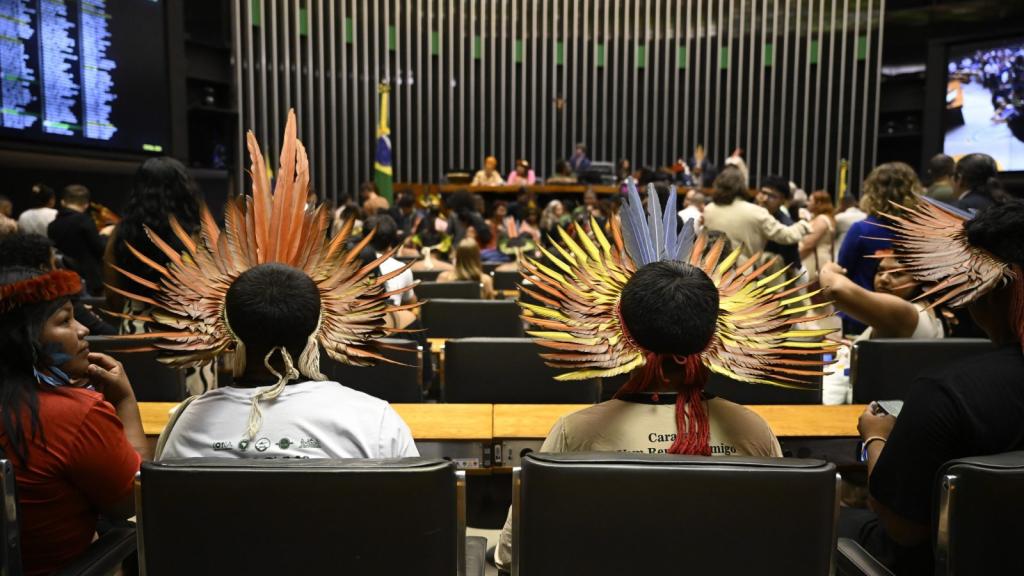 People sitting down next to each other