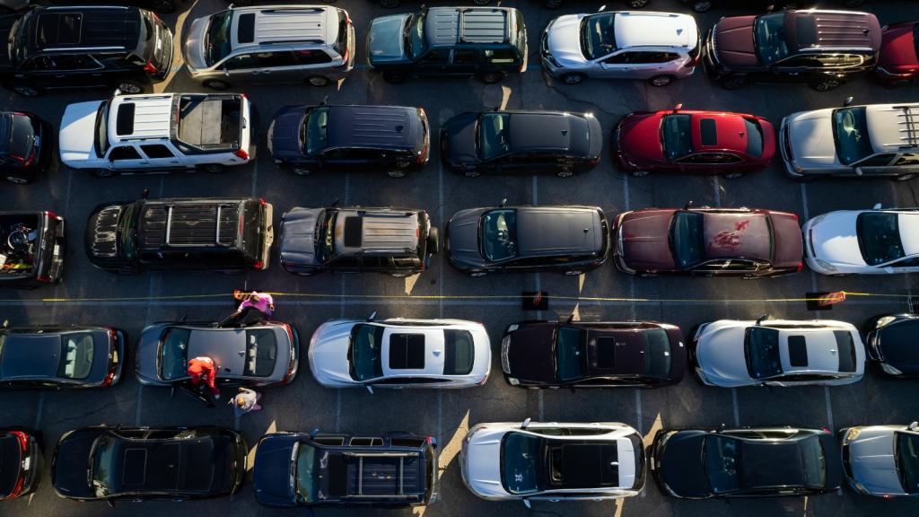 Several lines of cars are pictured from overhead