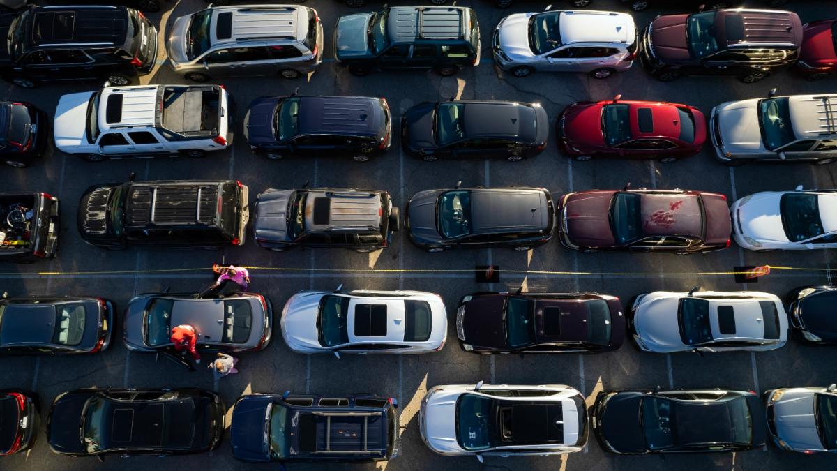 Several lines of cars are pictured from overhead