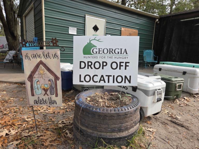 A sign advertises drop-off donations for Georgia's Hunters for the Hungry progra