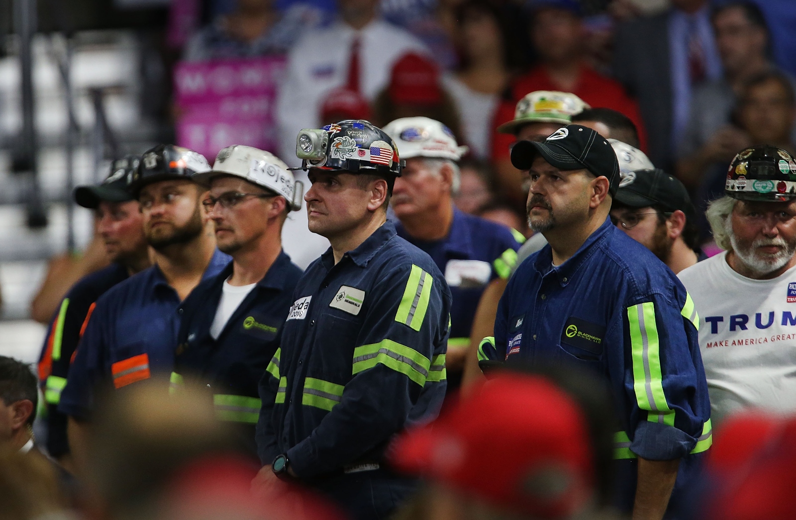 Coal miners listen as President Donald Trump speaks at a rally in Charleston, West Virginia, in 2018. The president has promised to boost coal power, but mining employment continues to decline.