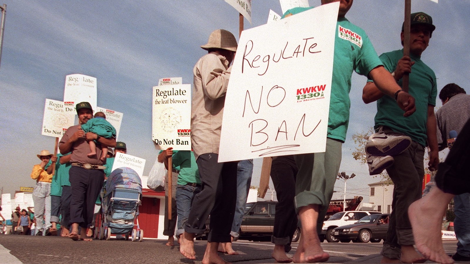 The Assn. of Latin American Gardeners of Los Angeles march along Beverly Blvd. Tuesday on their way to Los Angeles City Hall to protest the city ordinance prohibiting the use of gas–powered leaf blowers