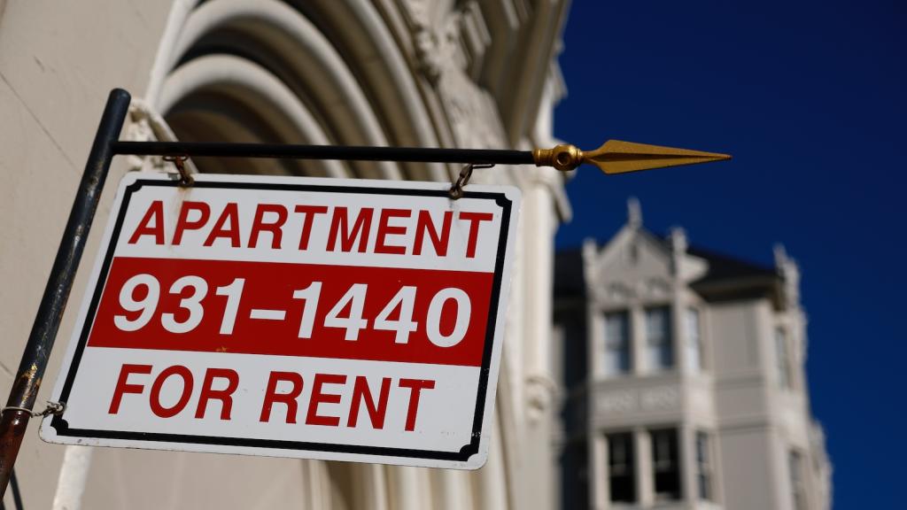 An apartment for rent sign hangs outside of an apartment building on December 04, 2025 in San Francisco.