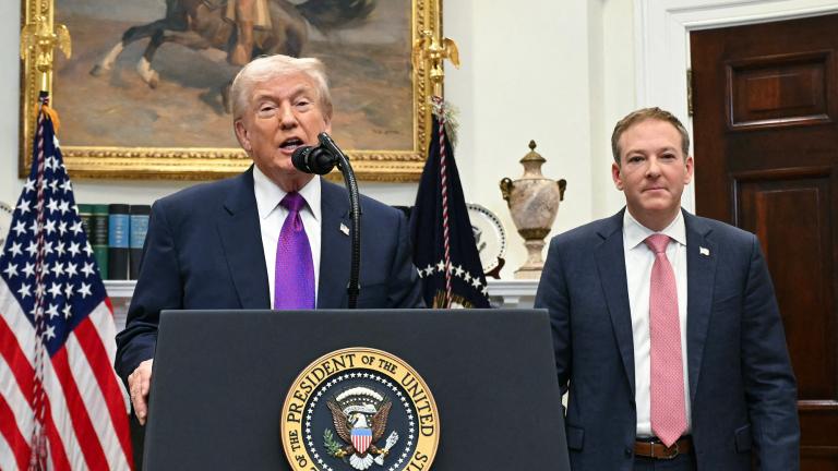 President Donald Trump and Lee Zeldin stand in front of a podium at the White House