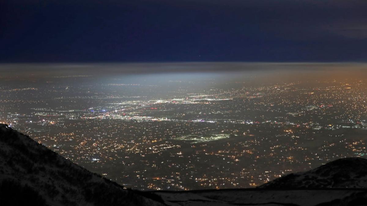 Salt Lake City valley at night time with a cloud of haze