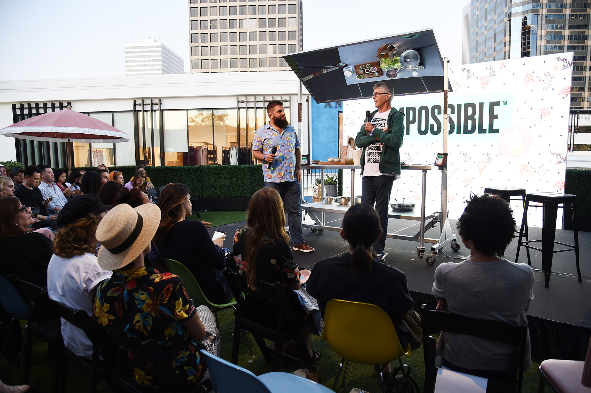 Impossible Foods founder Pat Brown speaks on a stage to a crowd of people in Los Angeles, California.