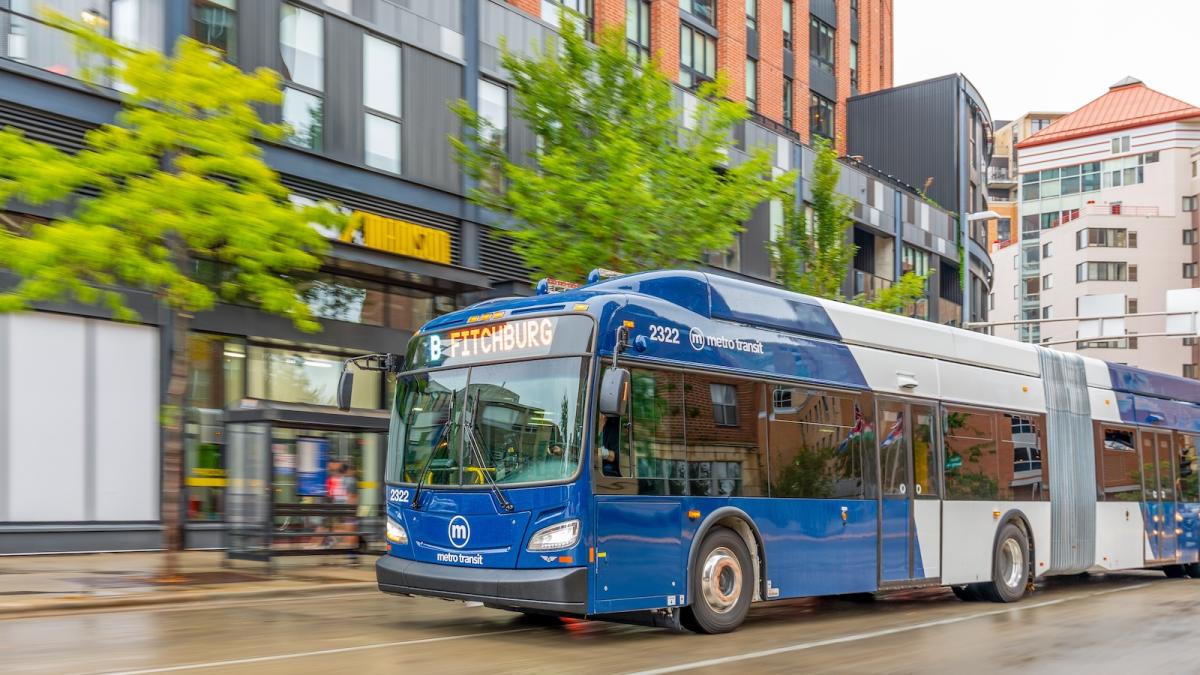 An electric bus rolls through the streets of Madison, Wisconsin.