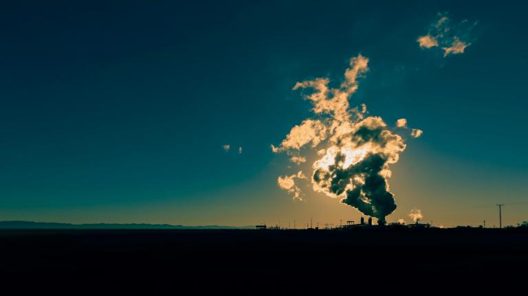 Sunlight glows through the steam of a geothermal power plant in Niland in California.