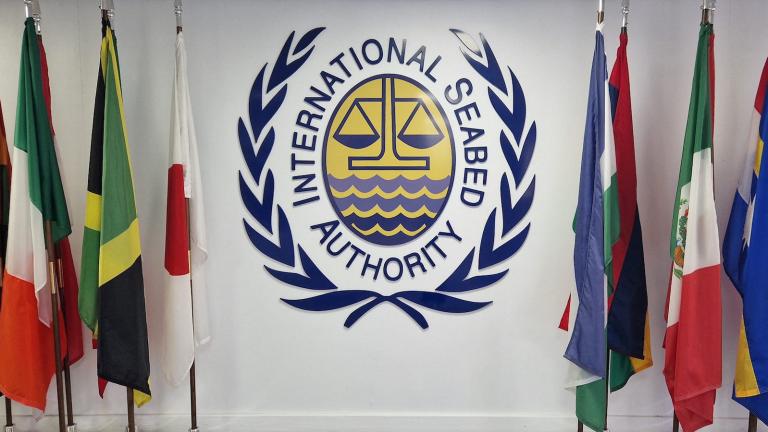 Flags beside the seal of the International Seabed Authority