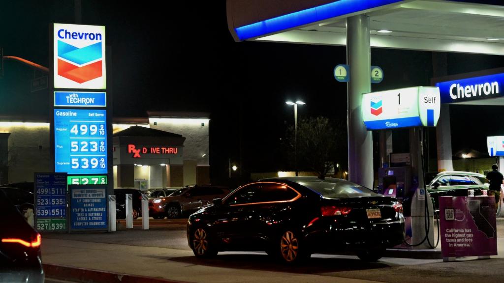 A sign with current gas prices is displayed at a gas station in Los Angeles, California on March 2, 2026.