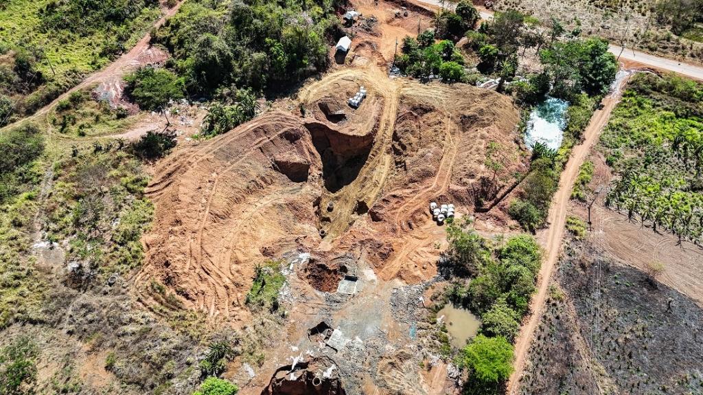 An overhead view of dug up dirt in the middle of a forest