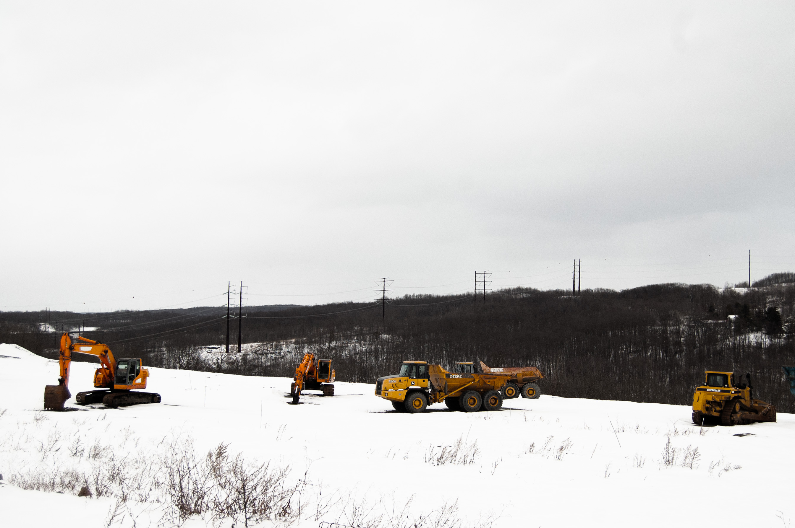 A high-voltage power line runs behind a construction site in Archbald, Pennsylvania.