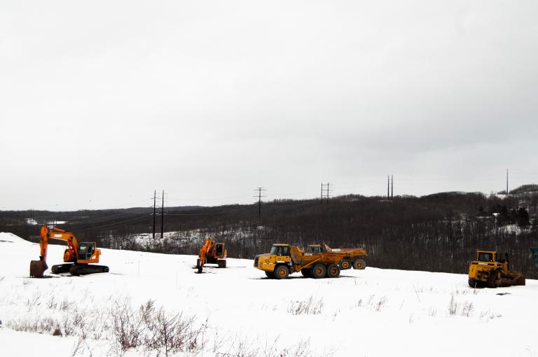 A high-voltage power line runs behind a construction site in Archbald, Pennsylvania.