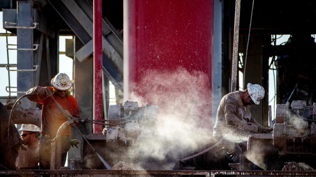 Hot steam rises as workers cool mud extracted from the drilling well at a geothermal energy plant near the Salton Sea.