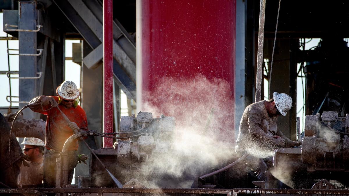 Hot steam rises as workers cool mud extracted from the drilling well at a geothermal energy plant near the Salton Sea.