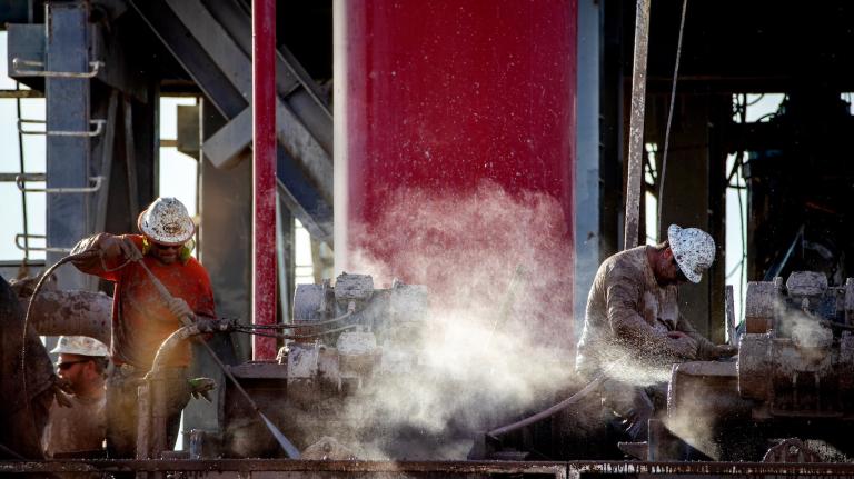 Hot steam rises as workers cool mud extracted from the drilling well at a geothermal energy plant near the Salton Sea.