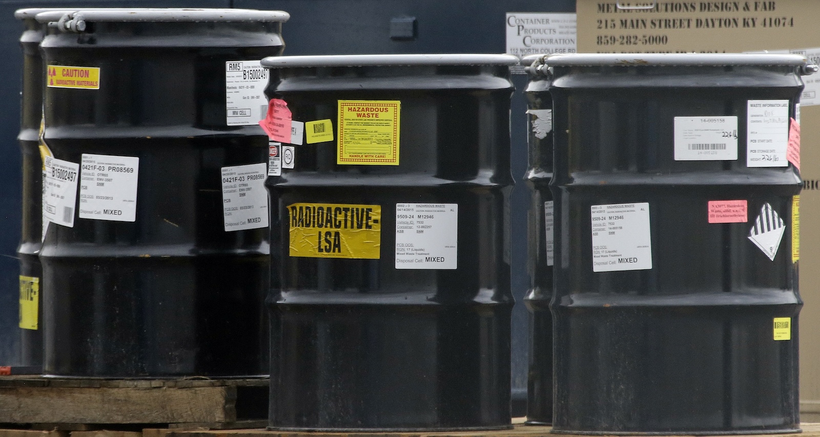 barrels labeled radioactive LSA and hazardous waste