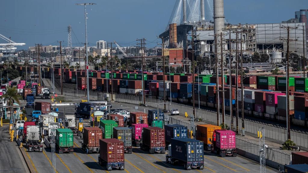 A port filled with trucks carrying containers