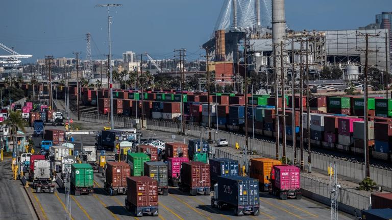 A port filled with trucks carrying containers