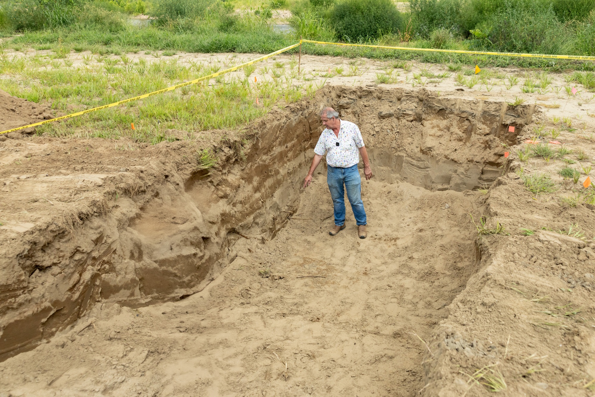 Soil scientist Forbes Walker visits Will Runion's farm in 2025, examining the deep sandy deposits left behind by Hurricane Helene.
