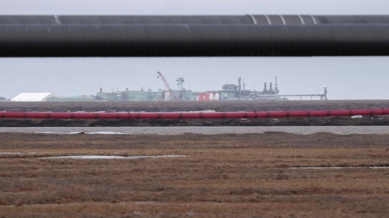 Landscape shown with oil pipelines.