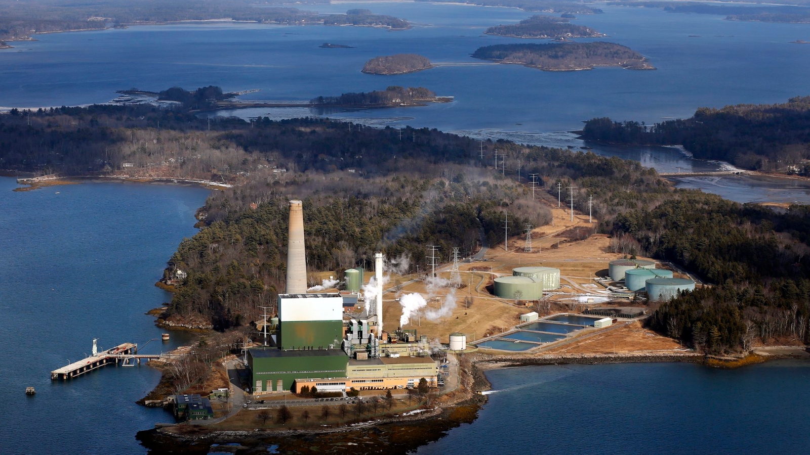 An aerial image of an industrial complex set on an island.