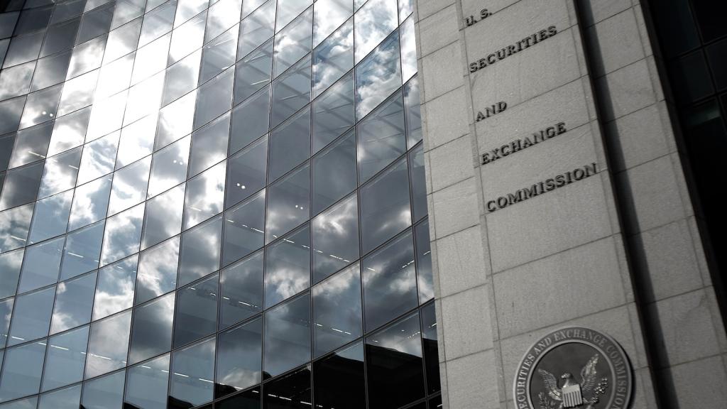 clouds reflected off windows on a building labeled securities and exchange comission