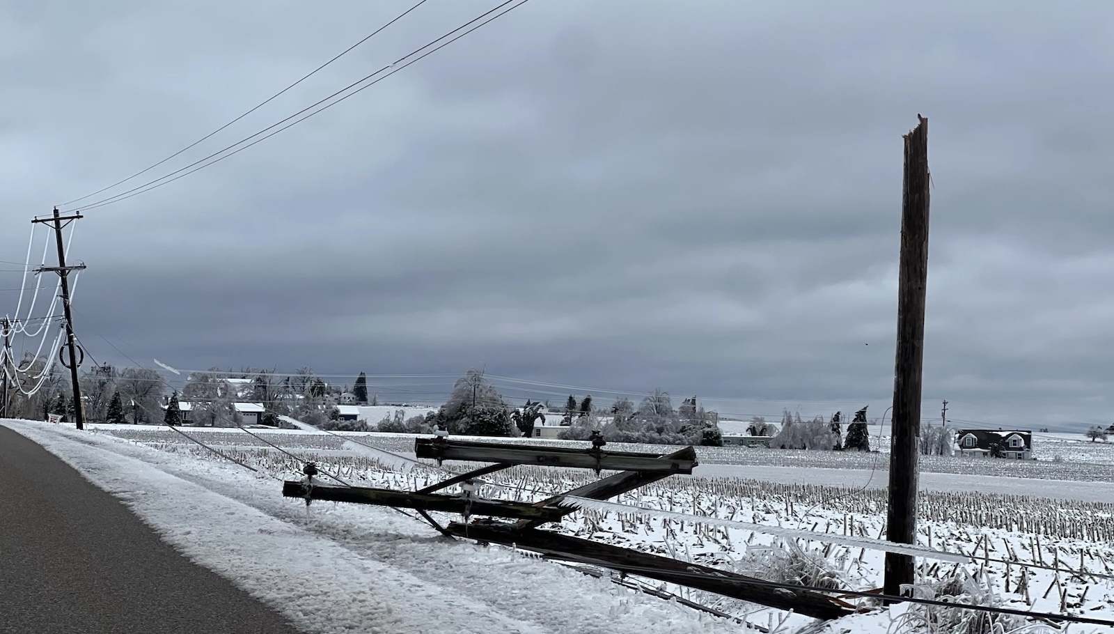 Snapped utility poles and wires from an ice storm