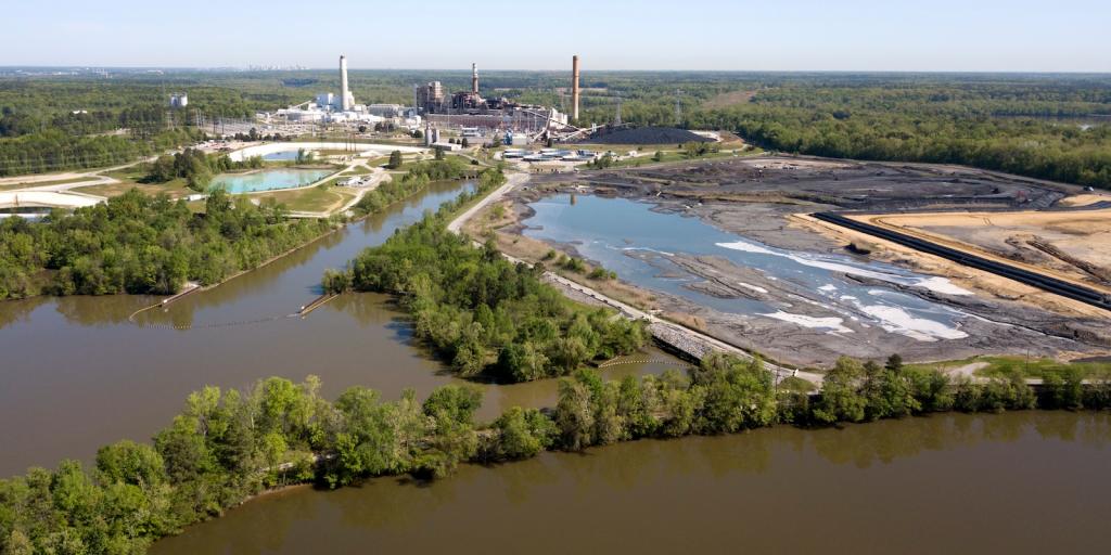 coal plant in the distance with lagoons in the foreground