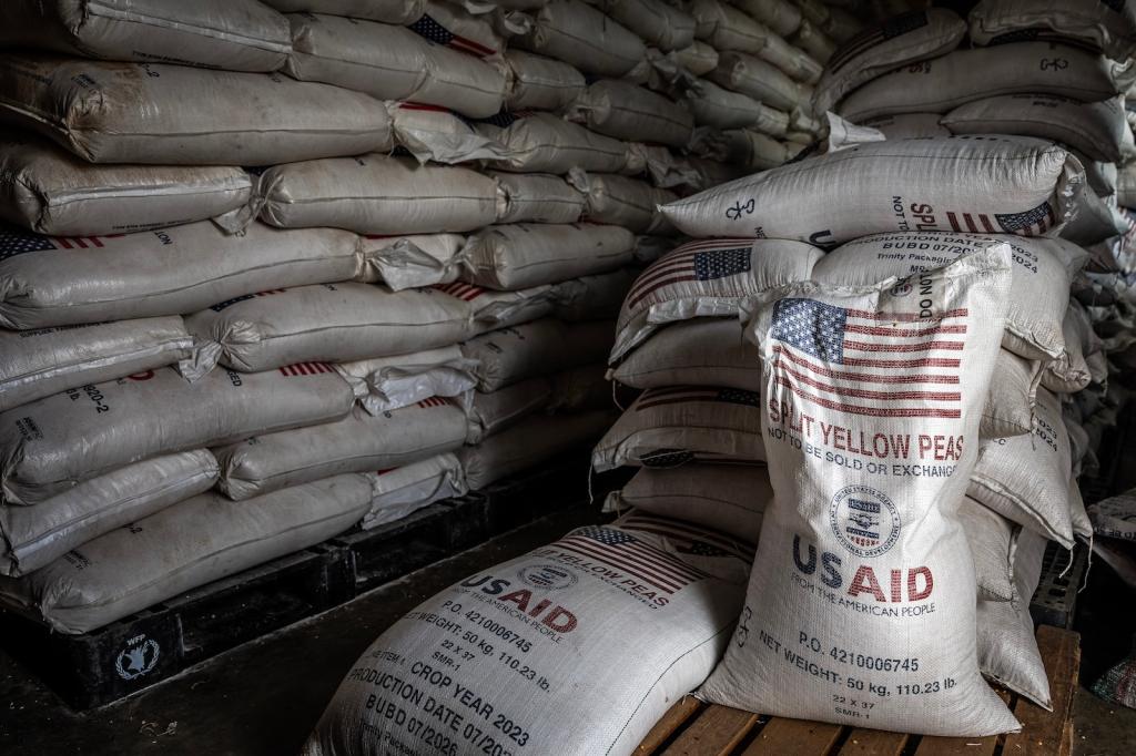 Sacks of the final batches of yellow peas delivered by the now-dismantled United States Agency for International Development (USAID) are stacked in a storage room