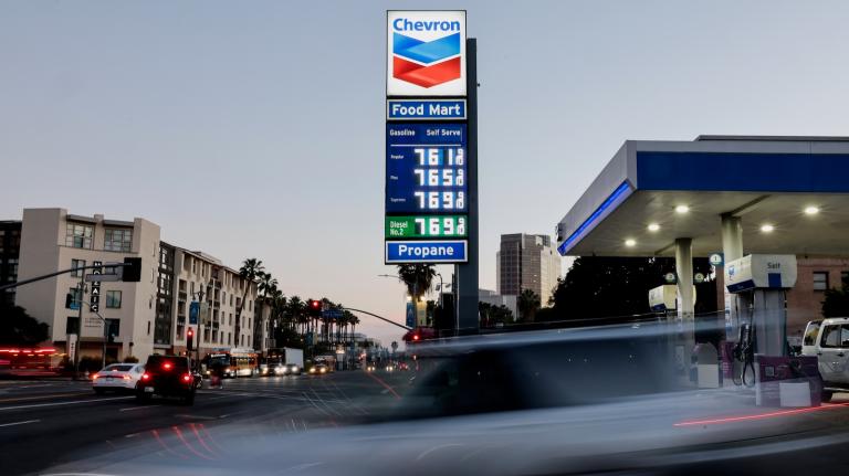 The illuminated sign outside a Chevron gas station in Los Angeles displays the price of gasoline.