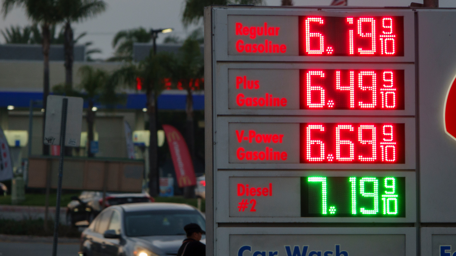Photo of gas station price board with regular gasoline at 6.19 per gallon