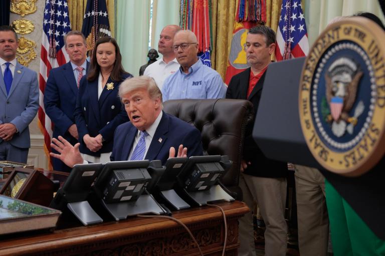 U.S. President Donald Trump is joined by grocery store owners and supermarket in the Oval Office