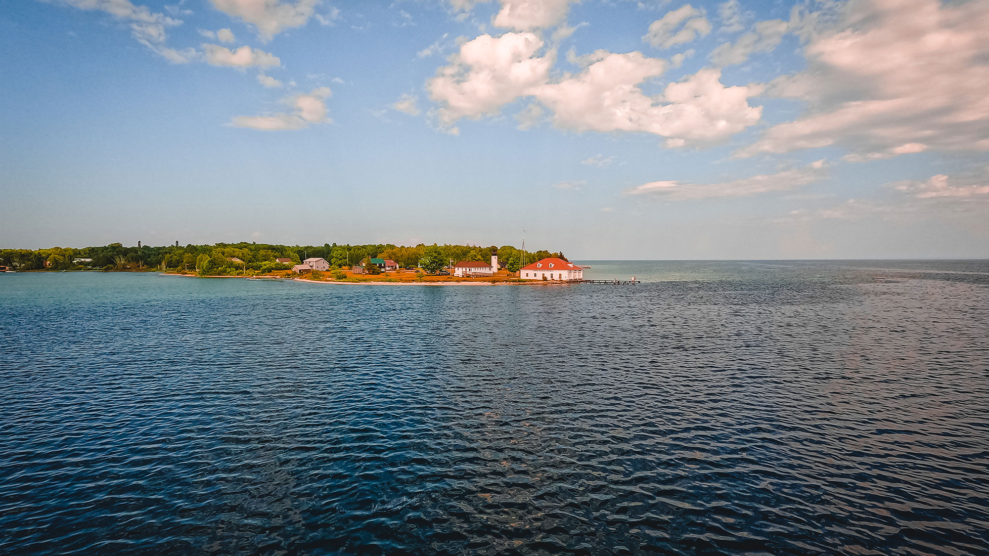 Looking out over the expansive blue lake waters to the largest island on Lake Michigan, Beaver Island.