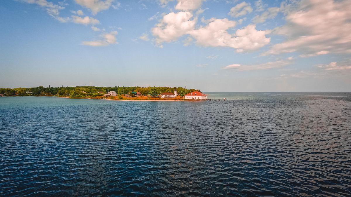 Looking out over the expansive blue lake waters to the largest island on Lake Michigan, Beaver Island.